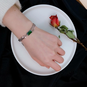 Double-layered silver titanium steel bracelet with rectangular emerald gemstone and curb chain