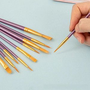 Detail of 10-piece nylon hair paintbrush set with purple pearlescent handles and gold ferrules