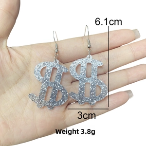 Silver glitter dollar sign earrings showing dimensions of 6.1cm height and 3.8g weight