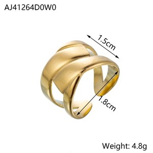 Detailed view of golden wide crisscross ring featuring a matte frosted finish and open band