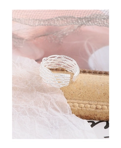 Macro detail of S925 sterling silver multilayer woven mesh ring with adjustable opening