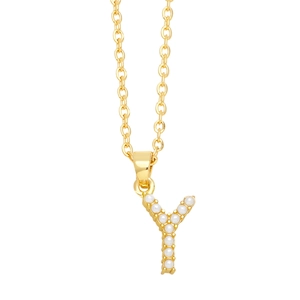 Close-up of golden letter Y pendant necklace featuring embedded white round pearls