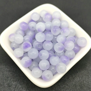 Macro shot of 8mm lavender and white gradient glass round beads for DIY jewelry making