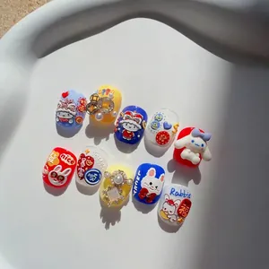 Embossed press-on nails featuring cute cartoon rabbit and traditional Chinese New Year motifs