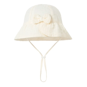 Detail of baby cotton bucket hat showing the gauze texture, bow, and adjustable strap