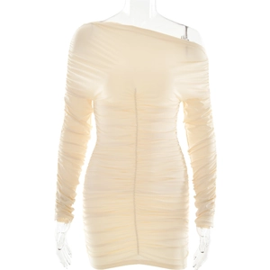 Detail shot of beige long sleeve bodycon dress with ruching on a transparent mannequin
