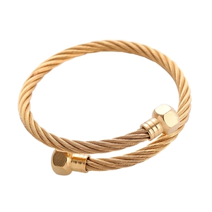 Gold stainless steel twisted cable cuff bracelet with hexagonal ends in punk style