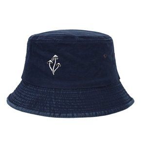 Detailed close-up of blue washed cotton bucket hat with white mushroom embroidery art