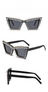 Detail view of cat eye sunglasses with rhinestones and pearls from multiple angles