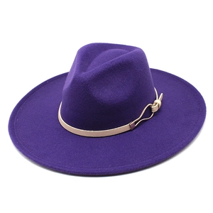 Detail view of purple wool fedora hat featuring a white leather band and metal buckle