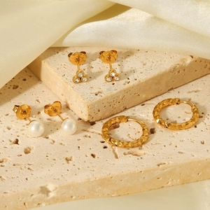 French style gold earring set with zircon, pearl studs, and hammered textured hoops