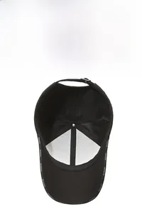 Close-up of black baseball cap showing breathable mesh, inner straps and metal buckle