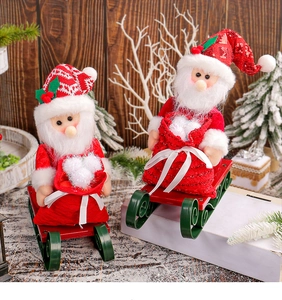 Detailed close-up of Santa Claus dolls on metal sleds with sequins and gift bags decor