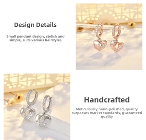 Detail of heart-shaped earrings featuring polished metal and pave-set crystals design