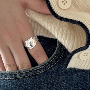 Minimalist 925 sterling silver wide irregular wavy ring for women in casual lifestyle scene