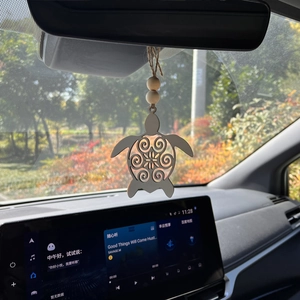 Wooden turtle car mirror ornament with hollow spiral pattern and rustic beads