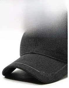 Detail of dark grey winter baseball cap showing waffle texture and SPORT brim embroidery