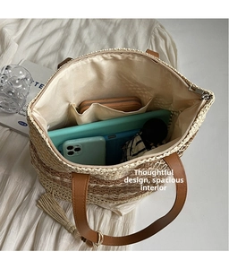 Large capacity straw tote bag showing interior space for phone, tablet, and umbrella