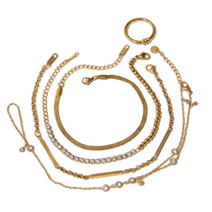 Elegant gold stainless steel multi-layered bracelet set with rings on a white background