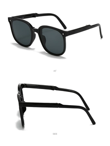 Detail view of foldable black kids sunglasses showing side hinge and compact structure