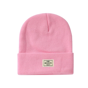 Pink knitted beanie hat with Brooklyn lettering patch for men and women