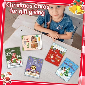 Kid arranging Christmas gift cards with lip balm holders on a cozy wooden desk