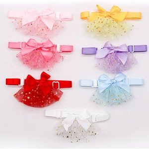 Detailed view of colorful pet collars in star tulle and ribbon with adjustable buckles
