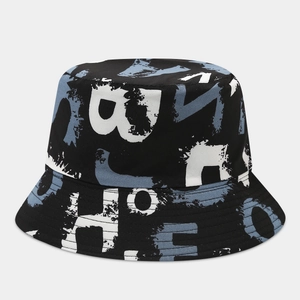 Close-up of graffiti print detail on black reversible cotton bucket hat with blue accents