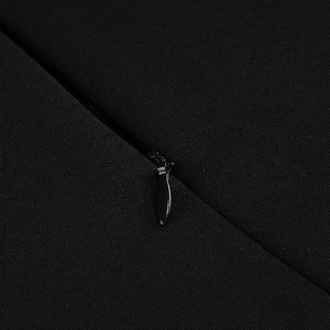 Detailed macro view of high-quality concealed back zipper on black mesh evening dress