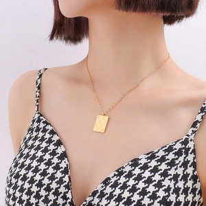 Vintage 18k gold plated stainless steel necklace with a checkered rectangular pendant