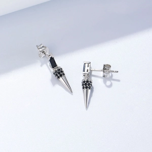 Detail of S925 sterling silver cone drop earrings with black zircon stones in punk style