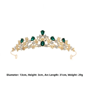 Detailed view of baroque vintage crown with green gems and dimensions 13x3cm