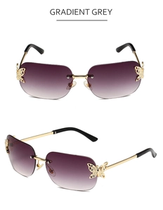 Detail of gradient grey rimless sunglasses featuring golden rhinestone butterfly accents