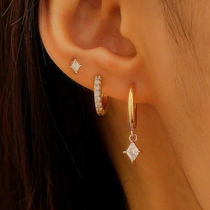 Three-piece set of gold earring hoops and diamond pendants with zircon stones