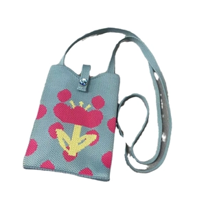 Blue knit crossbody mobile phone bag with pink flower pattern and button closure