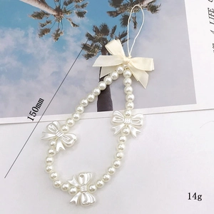 Handmade pearl phone strap with resin bows and ribbon, 150mm length and 14g weight