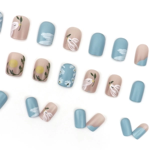 Short matte press-on nails with hand-painted birds and floral designs in pastel colors