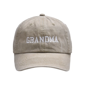 Detailed close-up of GRANDMA embroidery on washed cotton vintage baseball cap