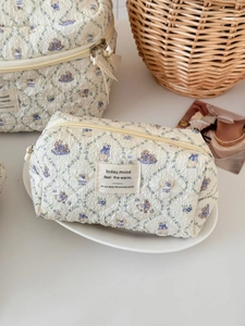 Quilted cotton cosmetic bag set with blue floral and rabbit print for storage
