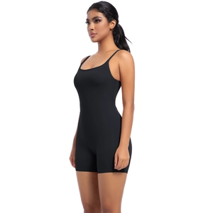 Side view of black high-stretch compression yoga bodysuit with thin straps and scoop neck