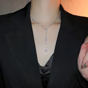 Silver Y-shaped tassel necklace featuring teardrop zircons on a sparkling diamond chain