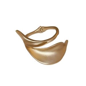 Modern matte gold open bangle featuring a minimalist overlapping leaf design and hinge
