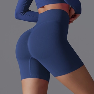 Detail of high-waisted navy blue seamless yoga shorts with ribbed waistband and scrunch butt