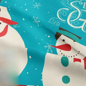 Detail of Christmas snowman knit tapestry with thick woven texture in teal blue