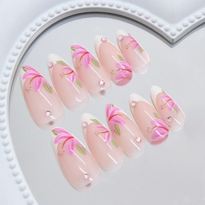 French lily press-on nails with pink glitter rhinestones in elegant stiletto shape