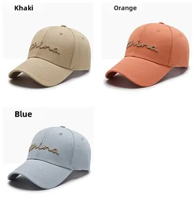 Close-up of baseball caps with 3D China embroidery in khaki, orange and blue colors