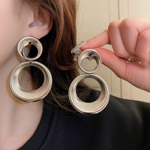 Silver metallic double geometric hoop earrings with textured finish for a stylish statement