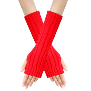 Detail of red cable knit fingerless gloves showing intricate texture and arm sleeve length