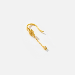 Close-up of a gold-plated S925 sterling silver drop earring with shimmering zircon stones