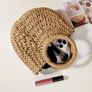 Top view of straw handbag showing capacity for phone and cosmetics for summer
